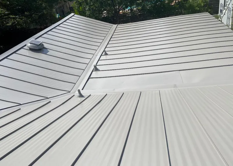 Solar attic fan installed on a metal roof for Roof Ventilation in Sans Souci